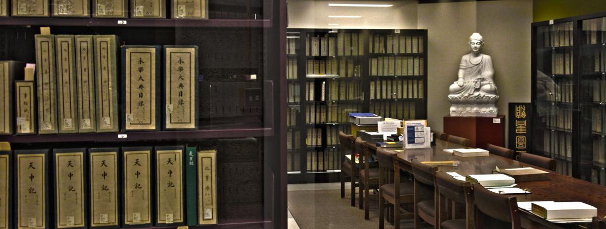 The EAL Rare Book Room featuring shelves of books and a statue of the Buddha.